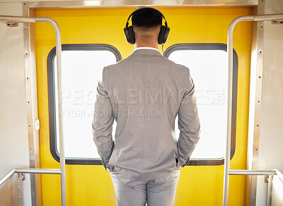 Buy stock photo Travel, businessman and headphones on metro listening to music, radio and podcast to work. Subway, corporate professional and back with transport and web audio on railway track and urban transit