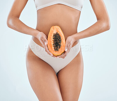 Buy stock photo Health, fruit and diet for woman in studio, food and nutrition on white background. Weight loss, papaya and vitamins or vegan for fibre and wellness, benefits or vitamin c for stomach or female model