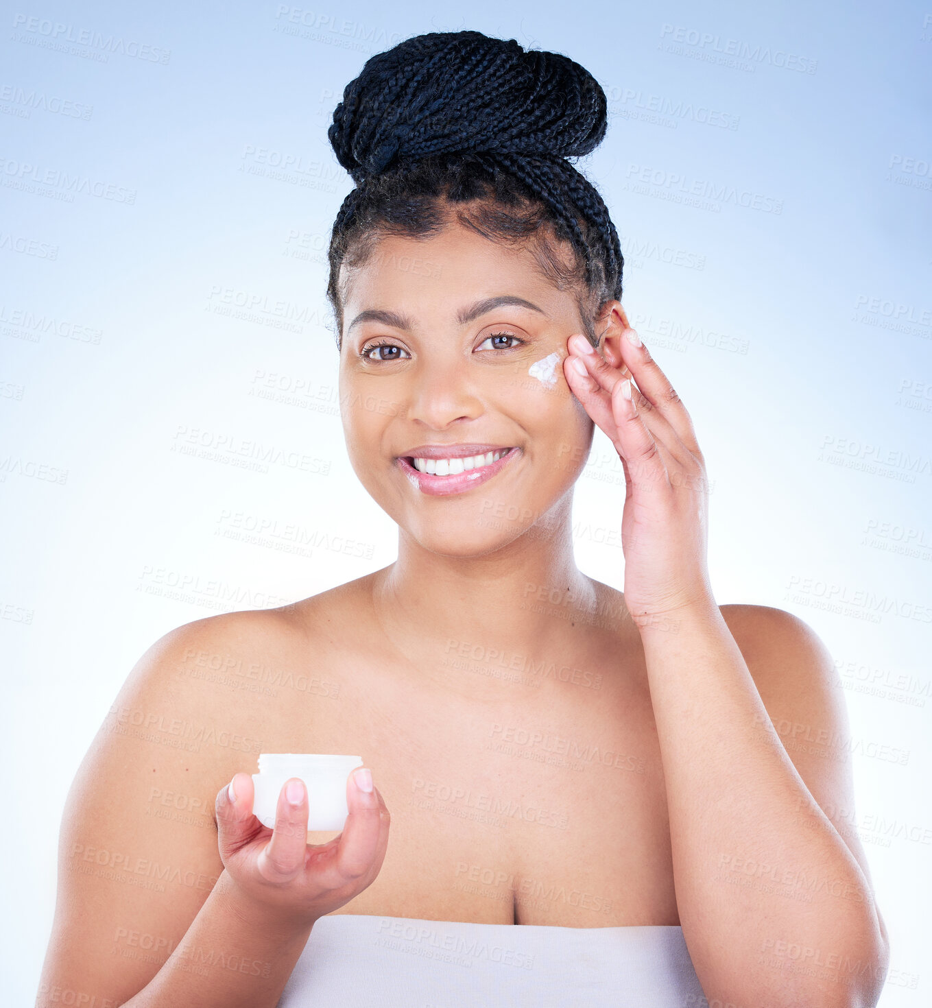 Buy stock photo Beauty, lotion and portrait of natural black woman in studio on blue background for wellness. Cosmetics, cream and skincare with face of confident model at spa for aesthetic or cosmetology treatment