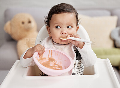 Buy stock photo High chair, food and baby eating in bowl for health, growth development and lunch or breakfast at home. Hungry newborn child or girl with healthy porridge, nutrition and spoon in mouth for learning