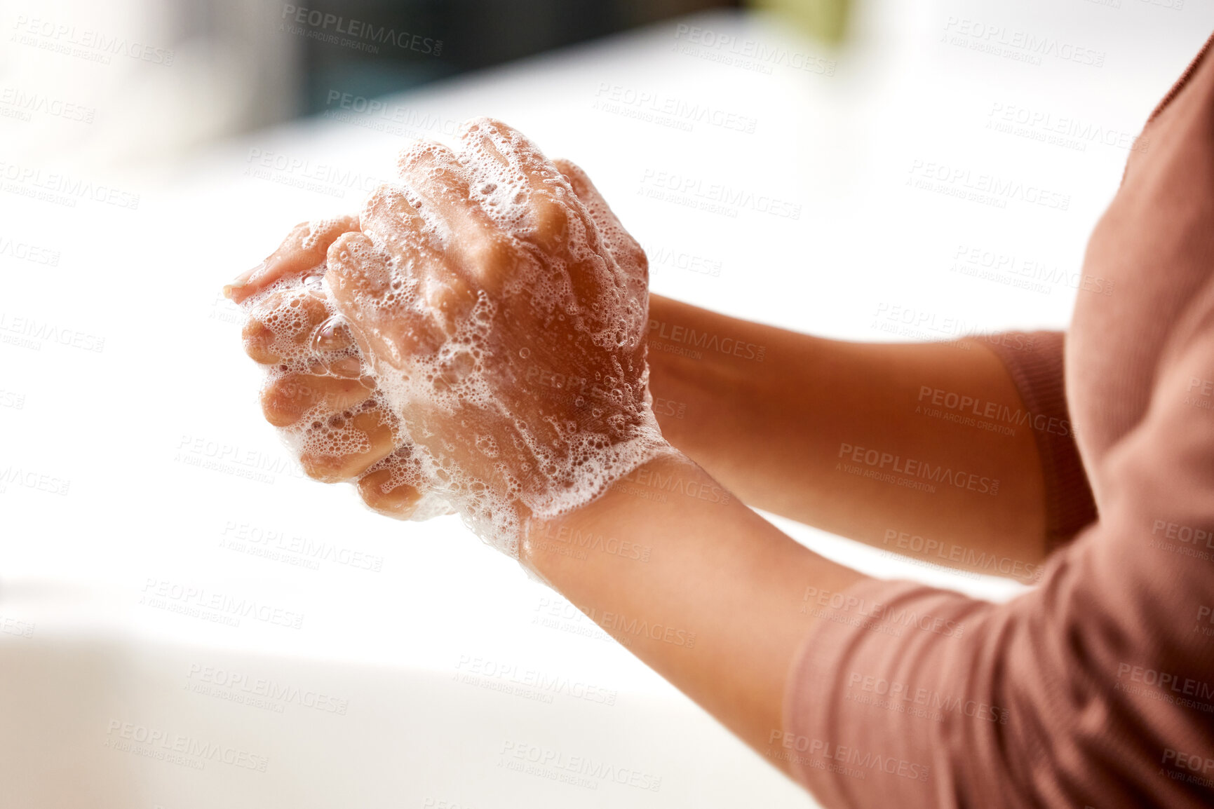 Buy stock photo Soap, foam and person washing hands in home, kitchen or bathroom for protection from bacteria germs. Clean, skincare and woman closeup with self care for hygiene, safety and healthy routine in house