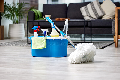 Buy stock photo Cleaning, bacteria and mop on the floor of a living room in a home for hygiene or service during housework. Product, detergent and safety with supplies in a bucket ready to clean a house for service