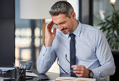 Buy stock photo Burnout, headache or stress with business man at desk in office for audit, compliance or tax. Anxiety, depression and mental health with mature employee in pain at corporate or professional workplace