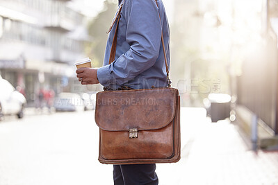 Buy stock photo Closeup, bag and man in city, business and commute with travelling, coffee or sunshine with latte. Outdoor, person or employee with morning tea, leather briefcase or professional with agent in street