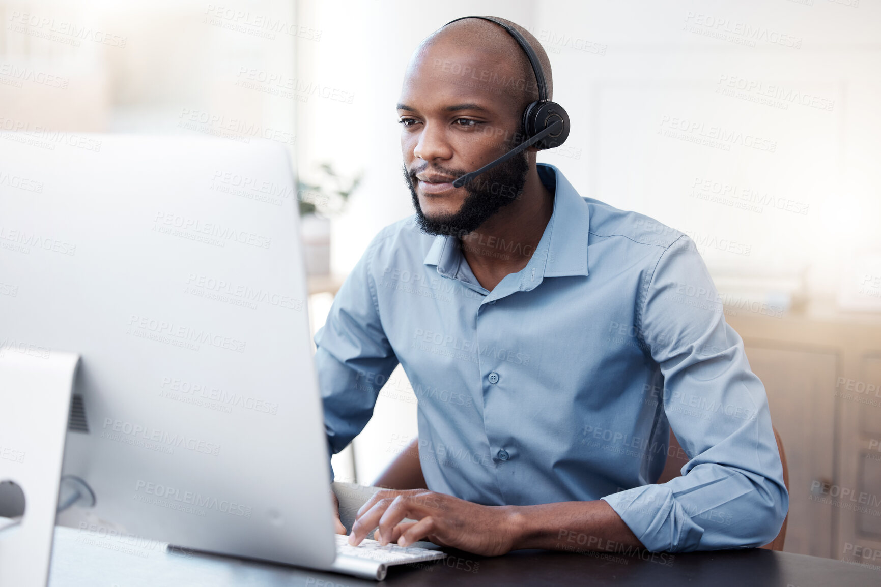 Buy stock photo Black man, computer and call center, contact us and communication, concentrate with headset and connect. Male agent with focus, customer service or tech support, help desk employee is reading online