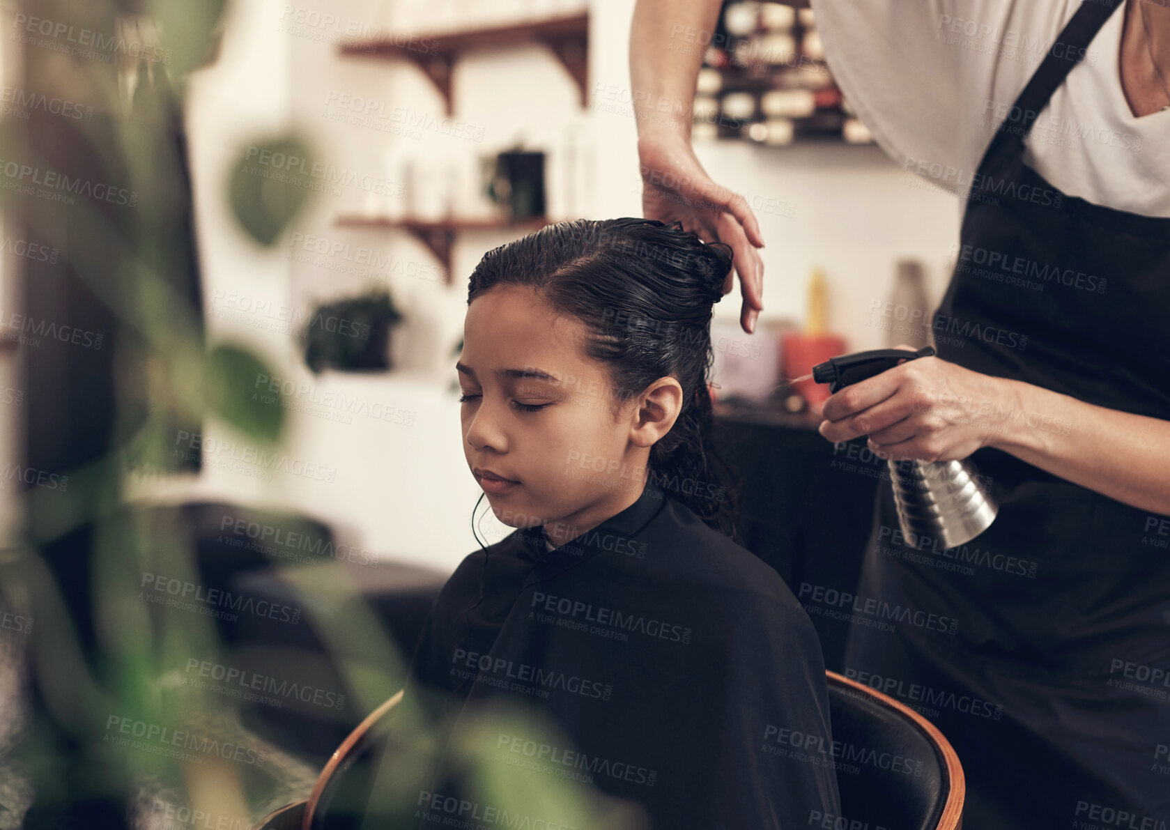 Buy stock photo Salon, haircut and style with girl, customer and spraying hair for grooming or wellness. Fashion, client and product with female hairdresser, beautician at work with child for kids haircare service