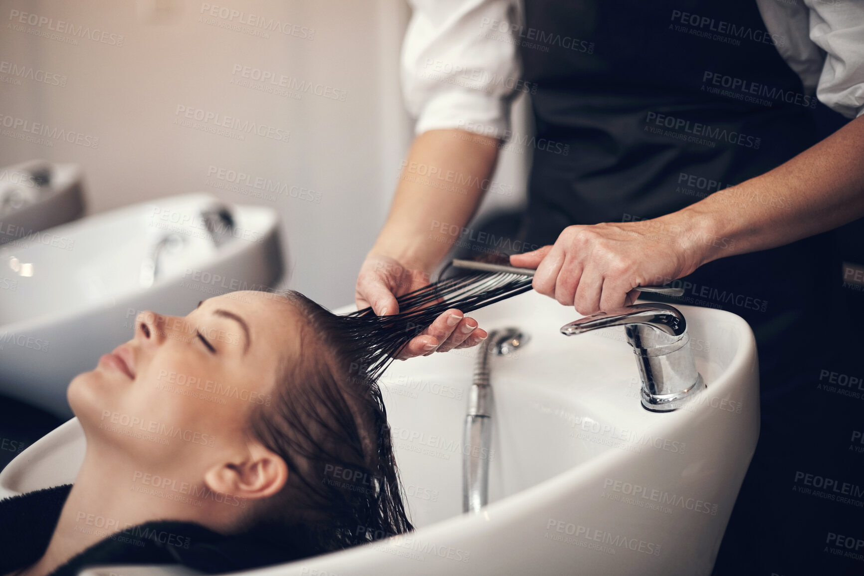Buy stock photo Woman, hairdresser and hair basin for washing, client and eyes closed or combing treatment with stylist. Professional, salon and haircare with customer, pamper and relaxing service with expert