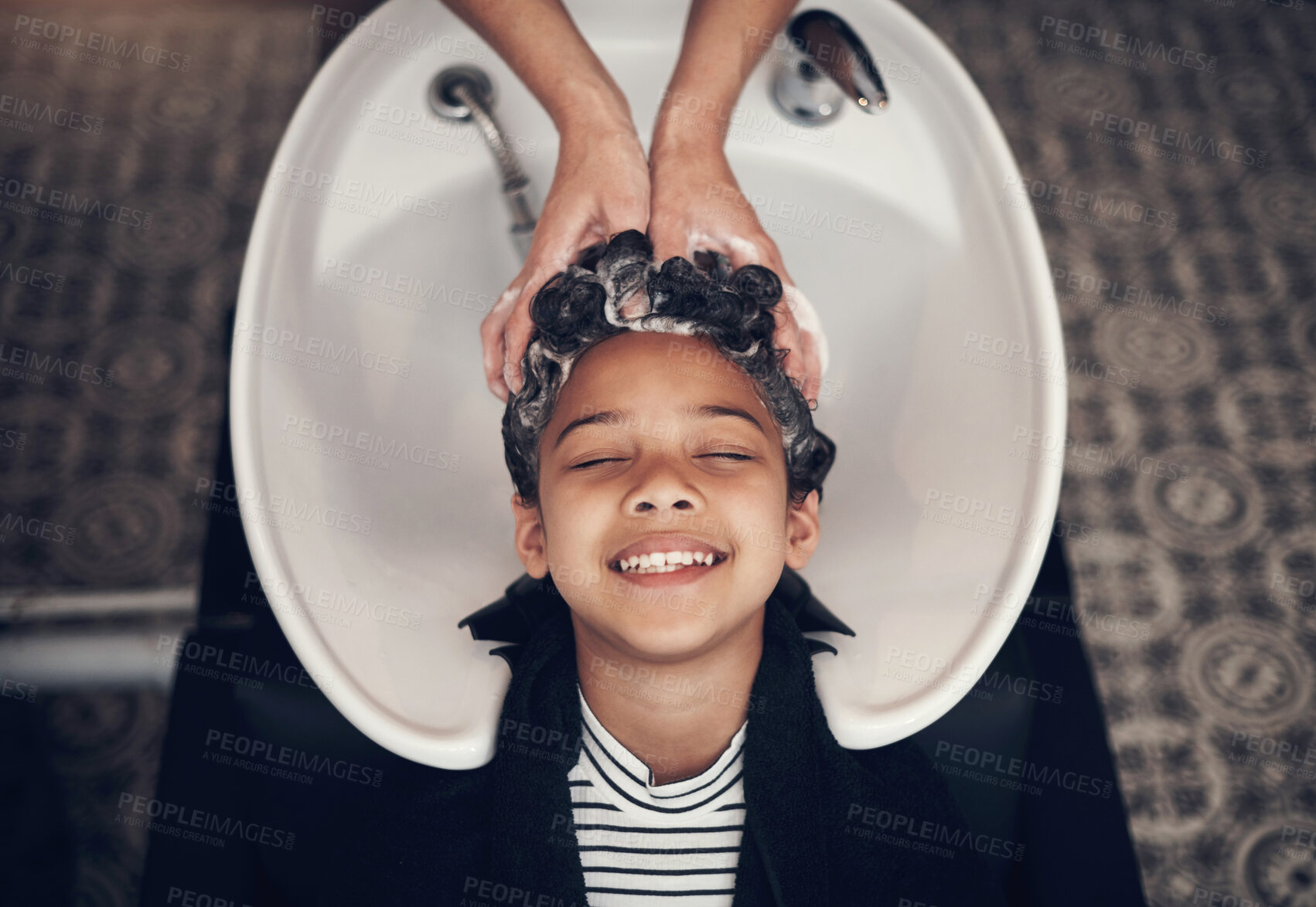 Buy stock photo Wash, girl child and hairdresser with hair care in salon for shampoo, treatment or conditioner. Top view, beauty and client with hands of stylist for cleaning, luxury massage or service by basin