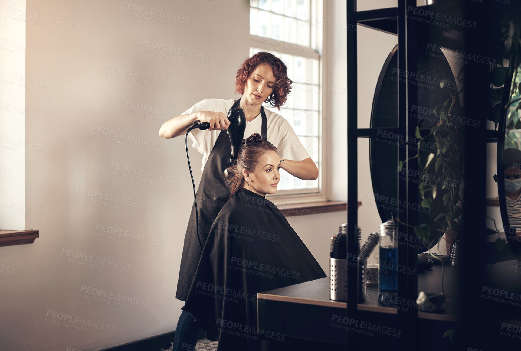 Buy stock photo Salon, haircut and style with woman, customer and hair dryer for grooming or wellness. Fashion, client and product with hairdresser, beautician at work with employee for startup haircare service