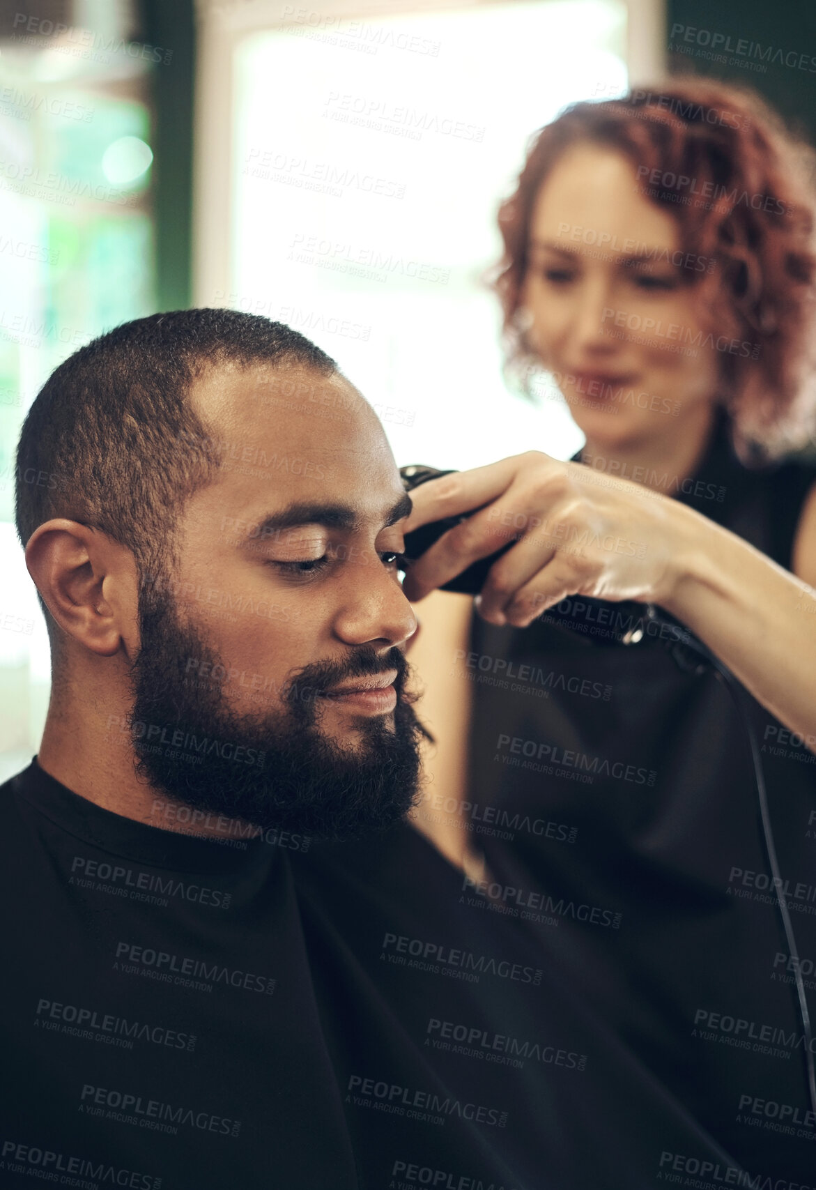 Buy stock photo Barber, shaving and hairdresser with man in salon for grooming, beard service and trim in boutique. Hair care, barbershop and stylist with shaver for client for appointment, treatment and hairstyle