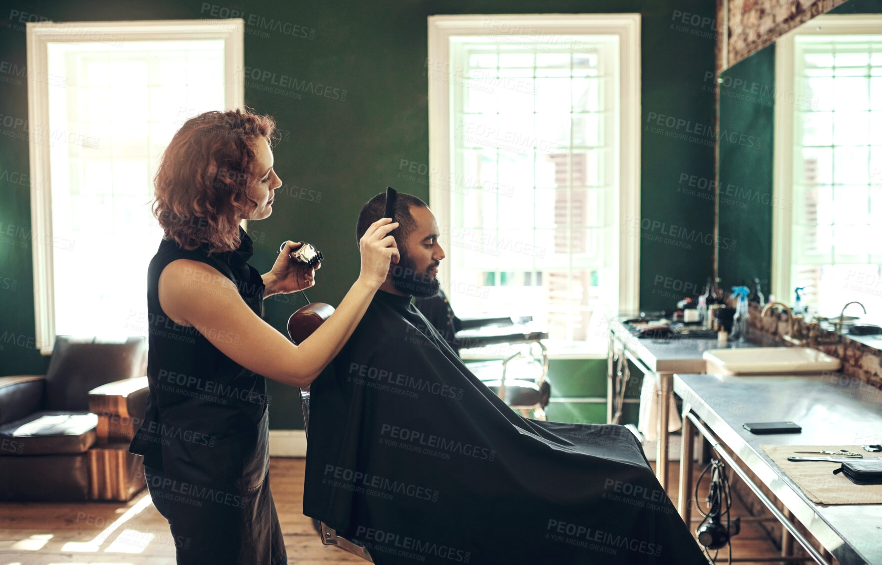 Buy stock photo Barber, salon and hairdresser with comb for man for grooming, beard service and trim in boutique. Hair care, barbershop and stylist with client in chair for appointment, treatment and hairstyle