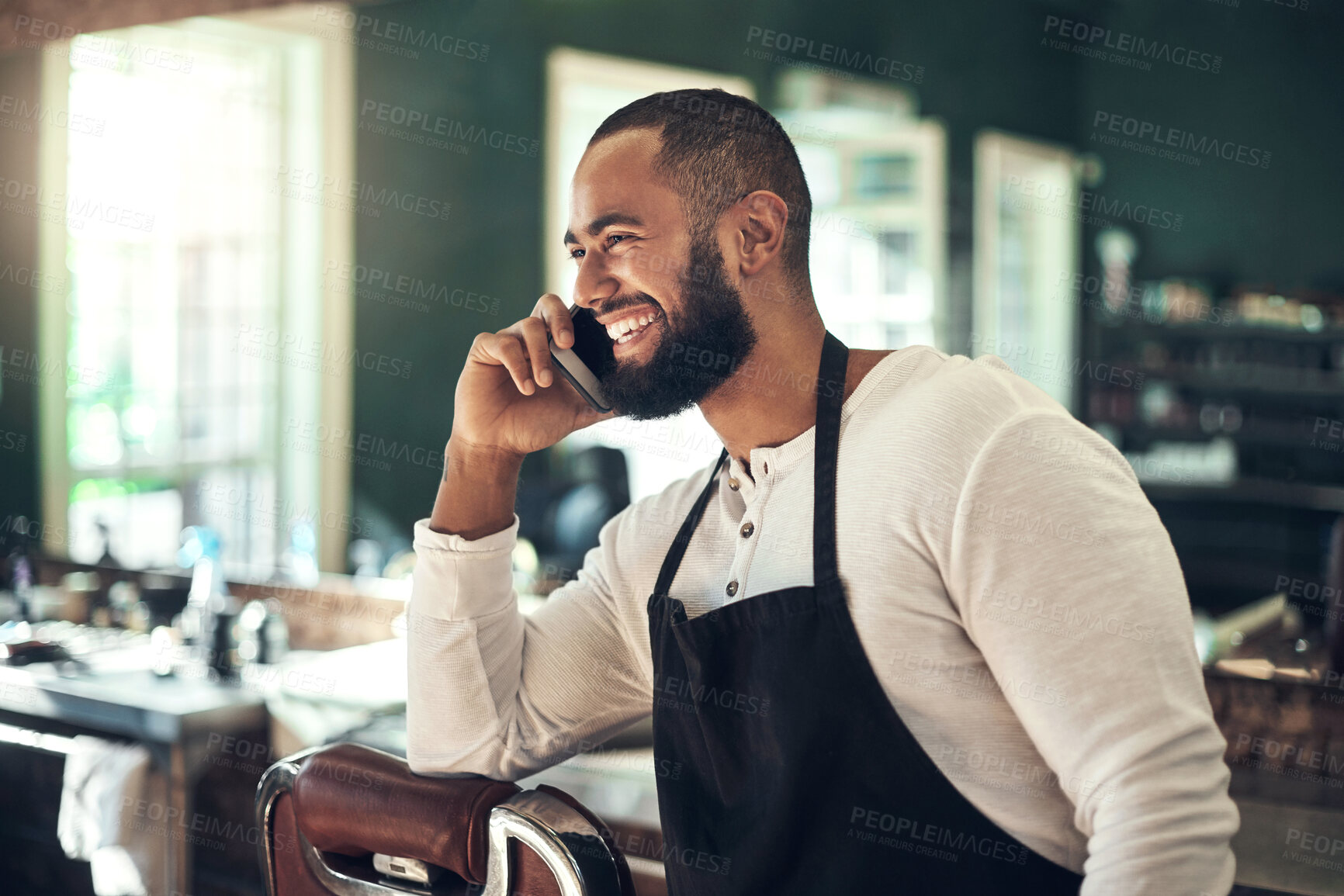 Buy stock photo Happy, barber and man with phone call at salon for small business, client and booking availability. Stylist, customer support and person with tech in hair care for appointment, consultation and info