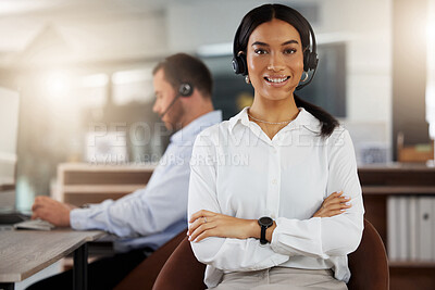 Buy stock photo Portrait of a young call centre agent working in an office at night
