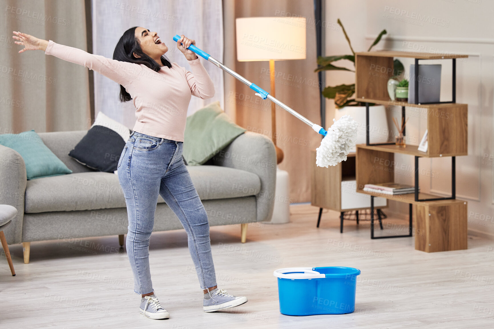 Buy stock photo Happy, woman and cleaning floor by singing with mop by dance to relax at home for hygiene routine . Smile, housewife and microphone with music for joy or health for wellness from virus or bacteria