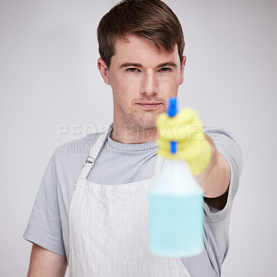 Buy stock photo Man, portrait and studio for cleaning with spray bottle, serious and disinfectant liquid cleaner for germs maintenance. Health, safety and hygiene, glove for bacteria protection on background