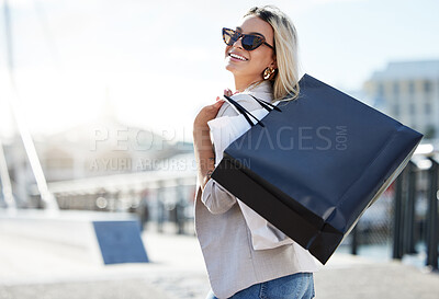 Buy stock photo Shopping bags, woman and smile with sunglasses in portrait with retail therapy for purchase with buying. Confidence, mockup space and relax with happiness on weekend in city with pride in London