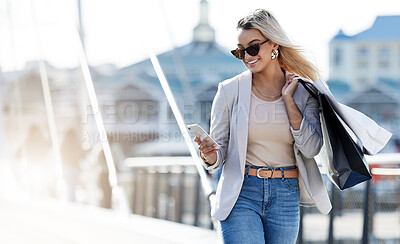 Buy stock photo Outdoor, smartphone and woman with bags, shopping or promotion with luxury products, New York or discount deal. Person, consumer and girl with sale, cellphone or fashion in urban town with retail