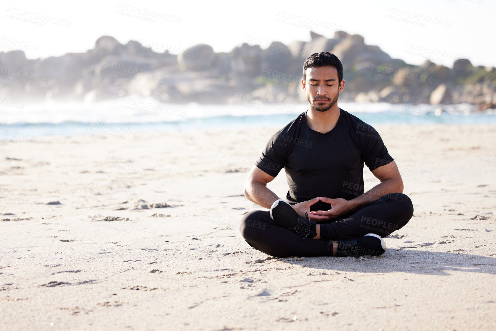 Buy stock photo Yoga, meditation and man with peace on beach for spiritual mindfulness or self care for healthy mindset. Calm, routine and person breathing with holistic wellness for zen chakra in summer at ocean