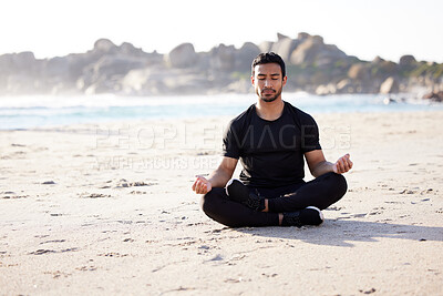 Buy stock photo Freedom, man sitting on the beach and meditation for peace of mind during summer. Relax or harmony meditating, mental health and male person on the sea sand for health wellness in fresh air outdoors