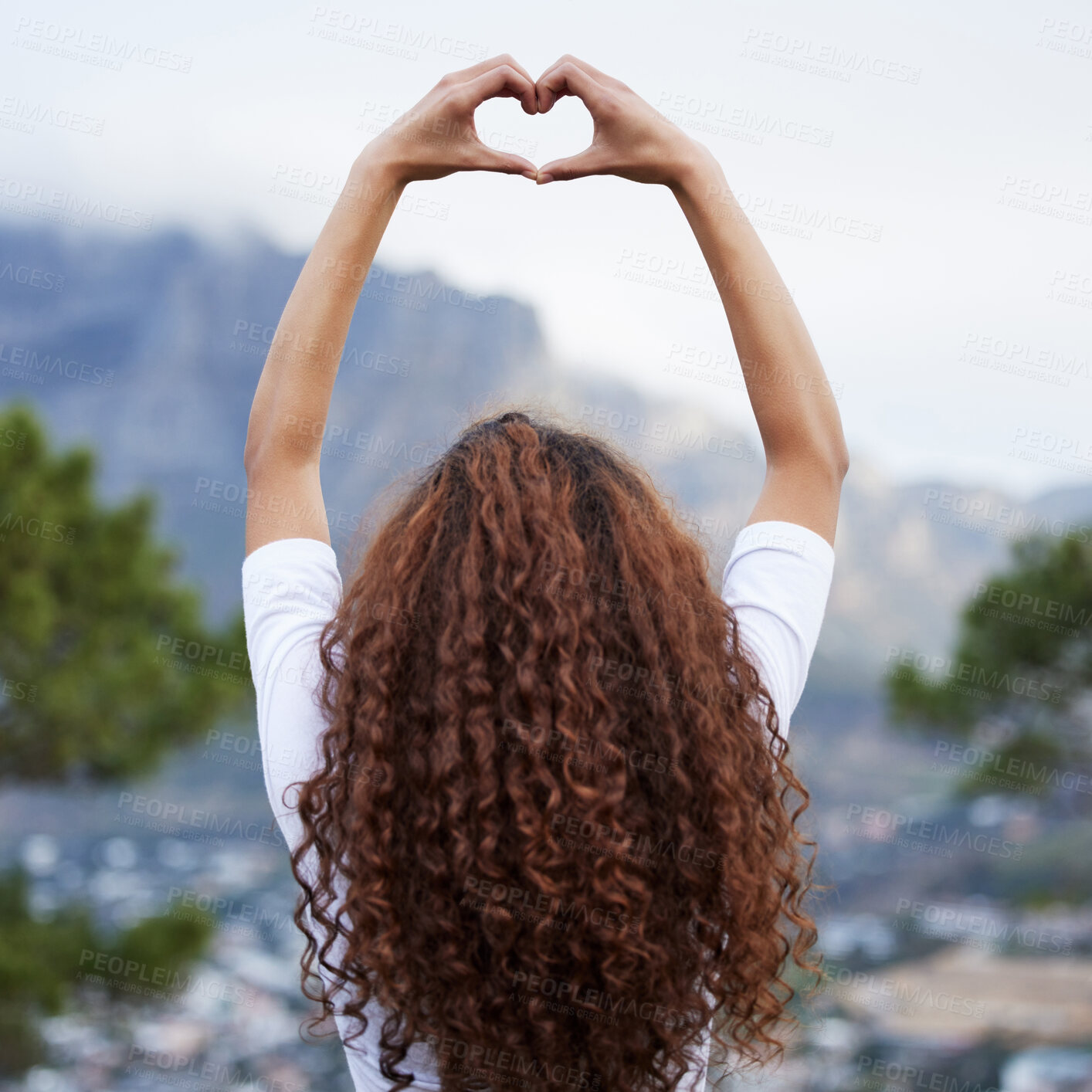 Buy stock photo Heart, hands and girl back outdoor with love sign for city view, experience or holiday trip or vacation success. Mountain, blur or woman show emoji finger or frame for adventure, freedom or gratitude