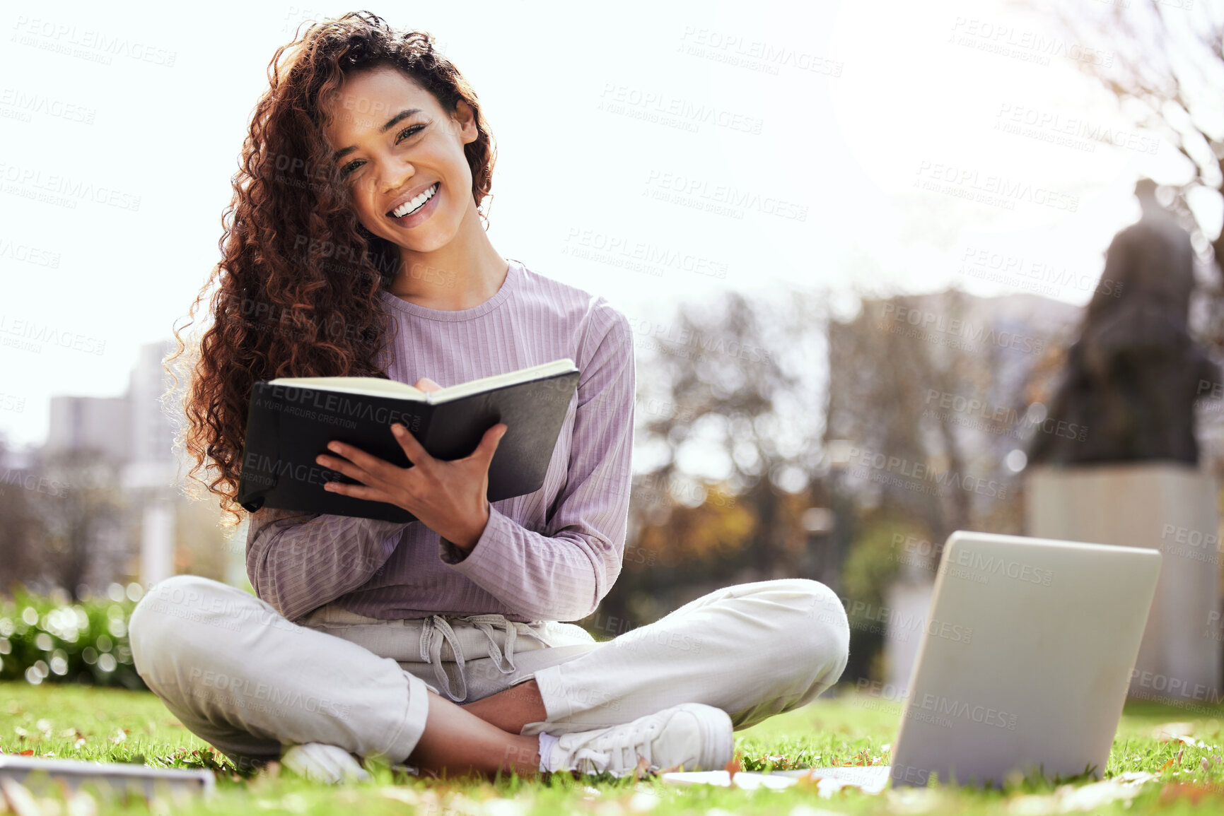 Buy stock photo Woman on lawn, laptop and notebook, college student on campus and studying course material and education. Happy female person in outdoor portrait, learn and study online notes on pc with scholarship