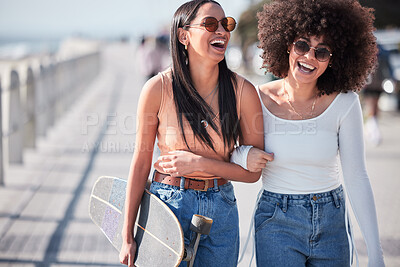 Buy stock photo Happy, friends and women in city holding hands with skateboard laughing for weekend, holiday and vacation. Excited, promenade and people walking for skating activity, bonding and adventure by ocean