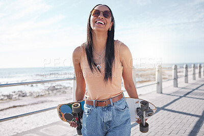 Buy stock photo Happy, summer and woman by sea with skateboard for weekend, holiday and vacation in trendy style. Fashion, laughing and person skateboarding for activity, freedom and adventure by ocean or seaside