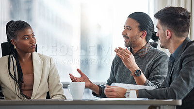 Buy stock photo Shot of a group of businesspeople having a meeting in a boardroom at work