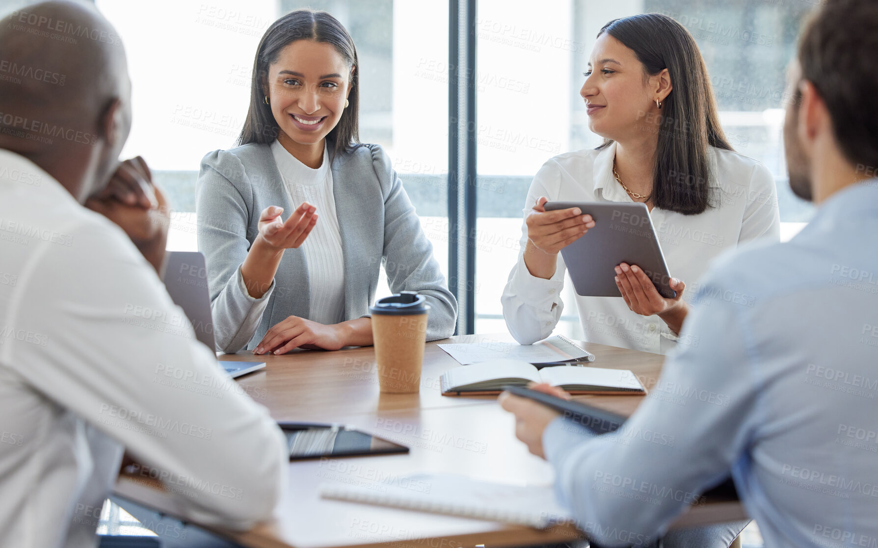 Buy stock photo Shot of a group of businesspeople having a meeting in a boardroom at work