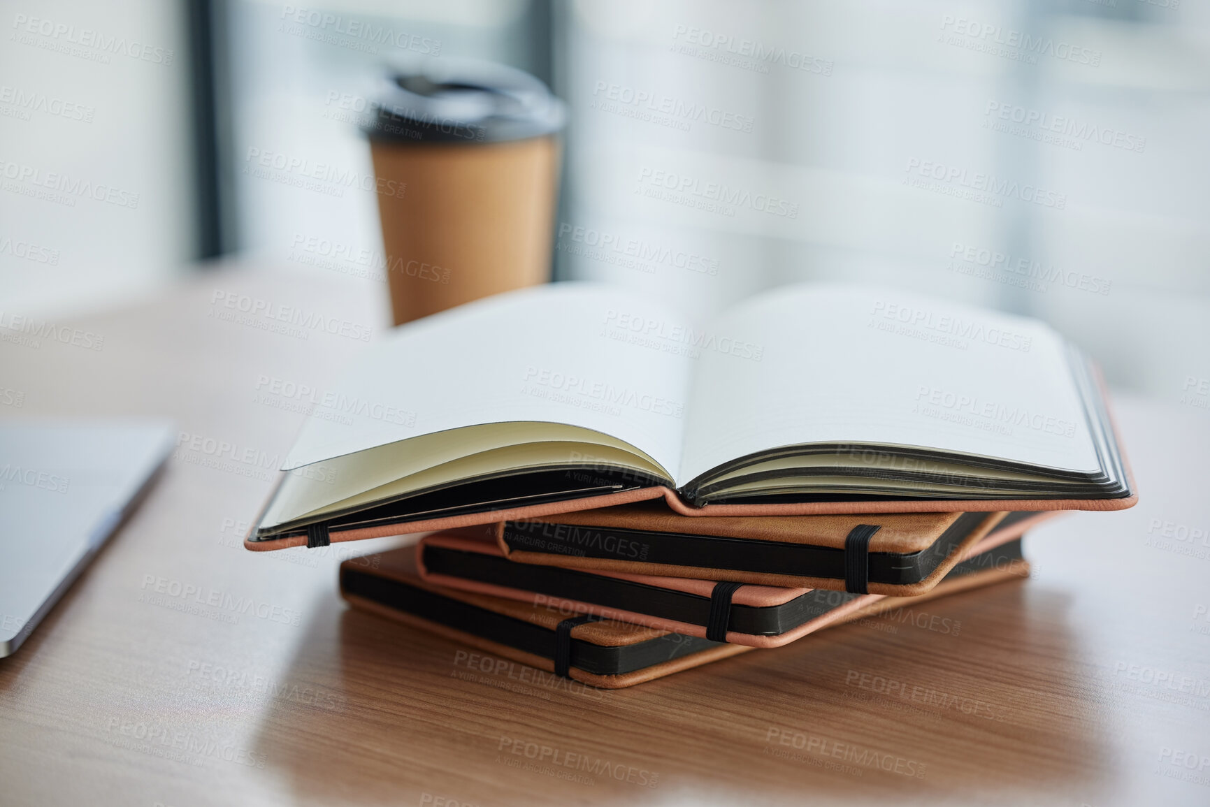 Buy stock photo Shot of a stack of books in a table in a modern office