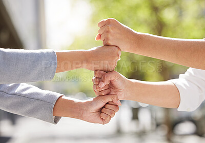 Buy stock photo Fists, team building or business people in city for collaboration for mission goals in a deal. Motivation, fist bumping closeup or employees with goals together, teamwork or support outdoors in park