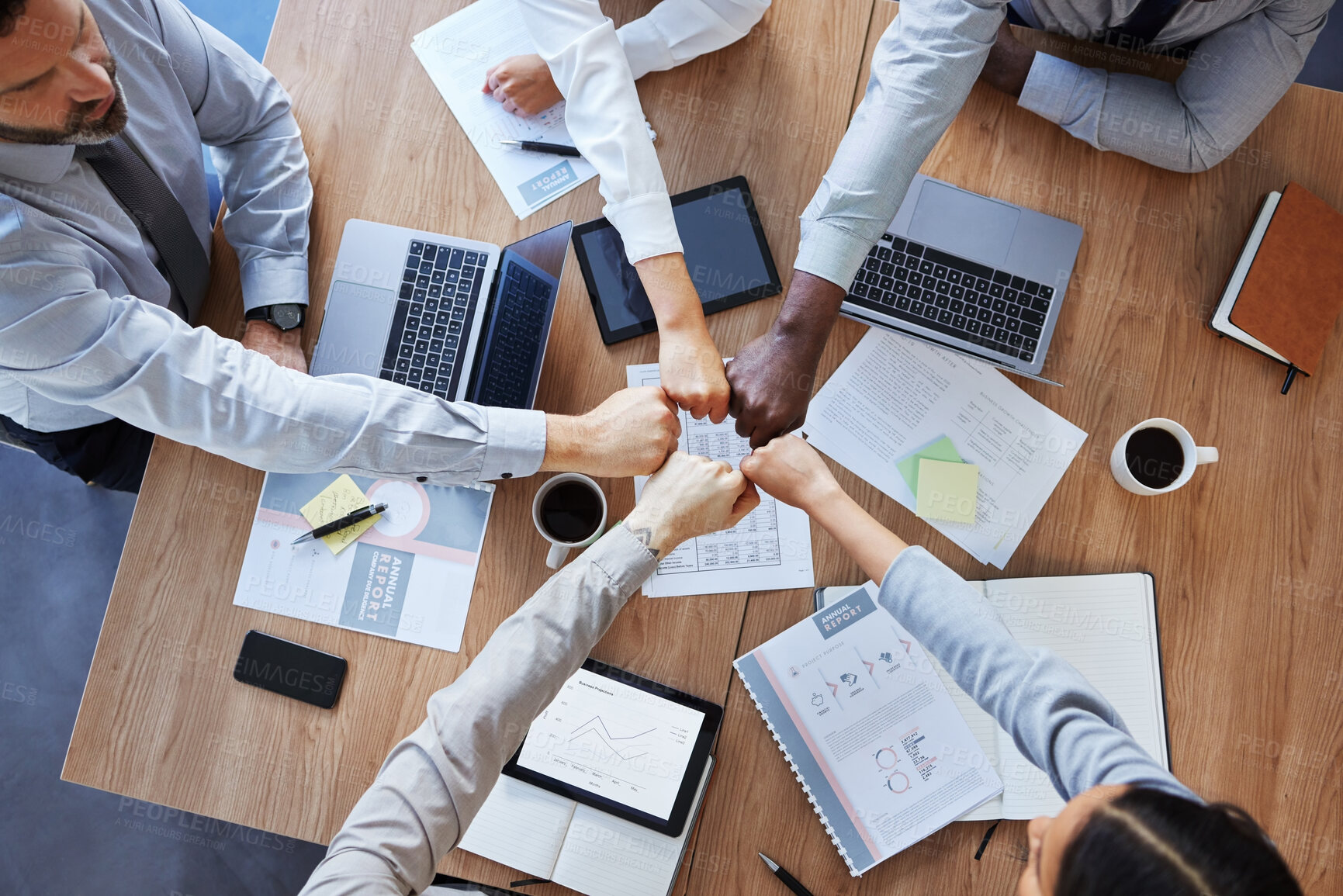 Buy stock photo Fist bump, team building or top view of business people in collaboration for group mission in company. Motivation, fists or employees in meeting with goals, teamwork or support in office together