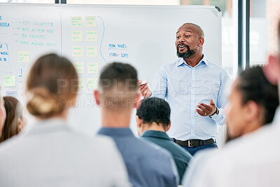 Buy stock photo Male speaker, conference and corporate team at training for company with learning on a board with audience. Business, presentation and coach is speaking to employees during a meeting at the office. 