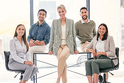 Buy stock photo Shot of a diverse group of businesspeople sitting in the office together during the day