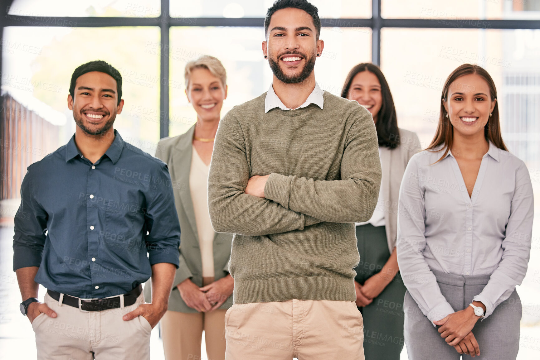 Buy stock photo Shot of a diverse group of businesspeople standing together in the office