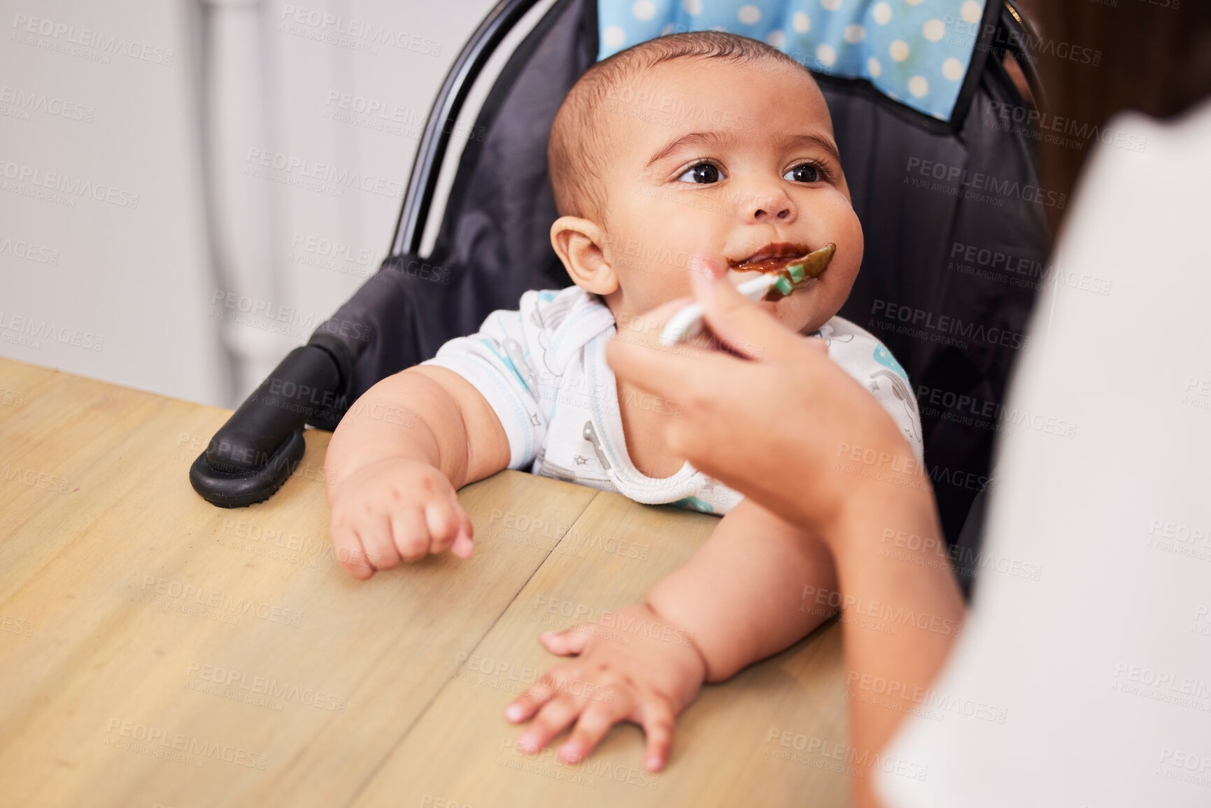 Buy stock photo Mom, eating and face of baby with spoon, food and health for growth, child development and breakfast in high chair. Diet, nutrition and infant at table with woman for morning feeding schedule in home