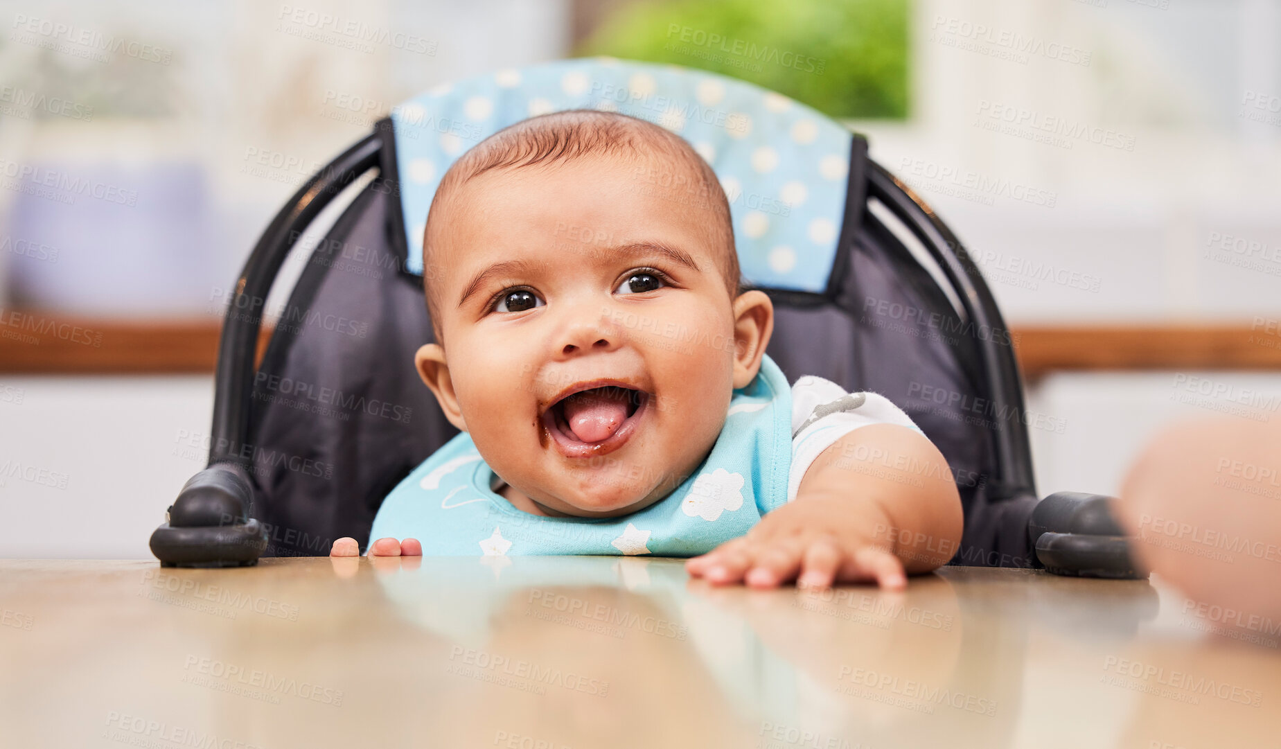 Buy stock photo Baby, boy and eating in kitchen for nutrition, happiness and messy mouth for growth development. Male person, infant and high chair for wellness in meal, breakfast and morning for learning in home