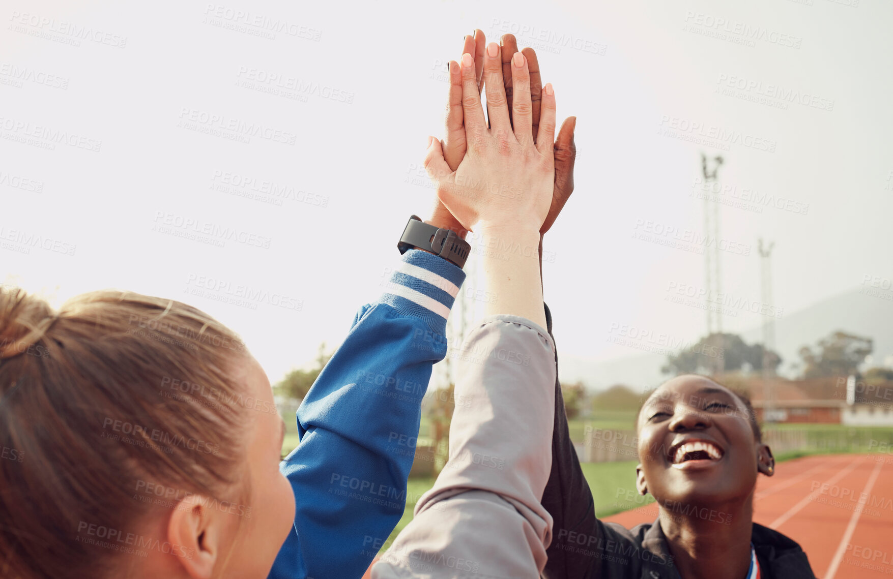 Buy stock photo People, diversity and high five in fitness for teamwork, unity or trust together on stadium track. Happy athlete group touching hands in team building for sports motivation, support or goals outdoors