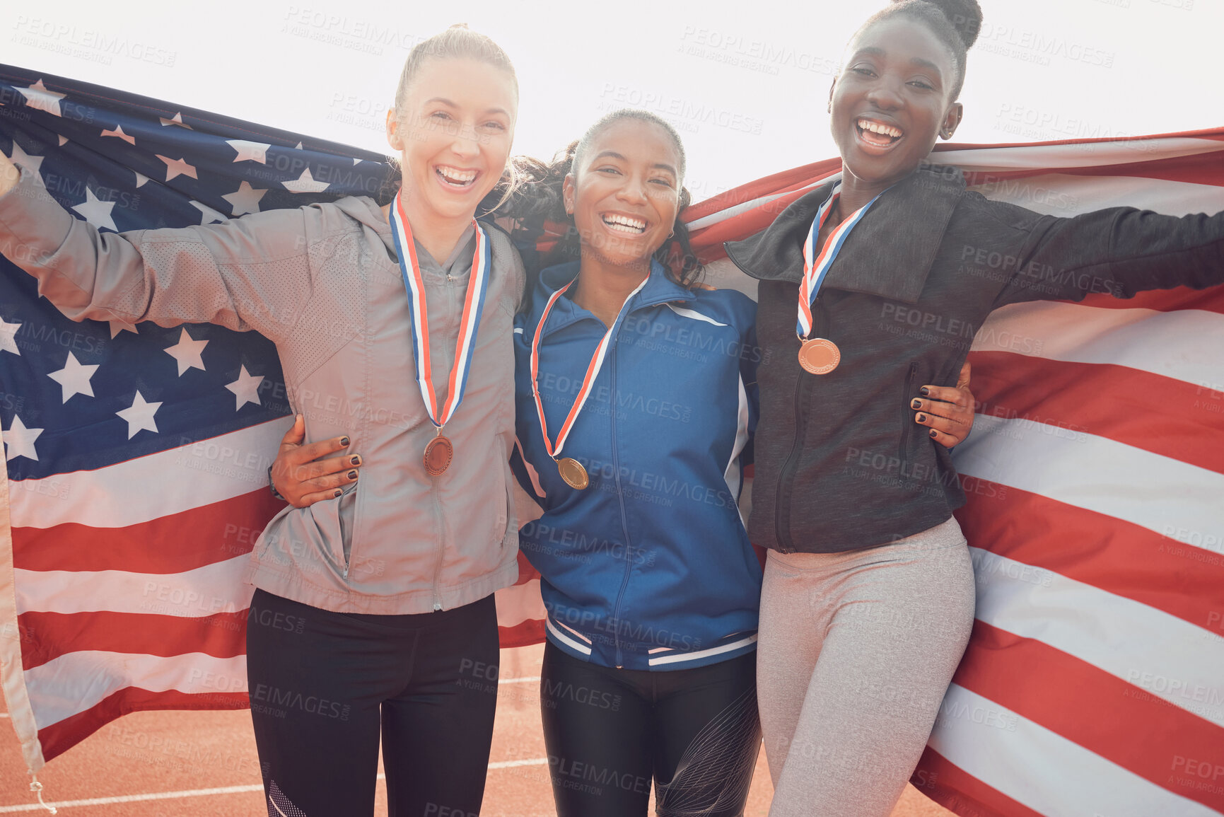 Buy stock photo Success flag, athlete and portrait of woman team on race track for celebration, achievement and happy for medal. American group, people and smile for winning, event victory or relay champion on field