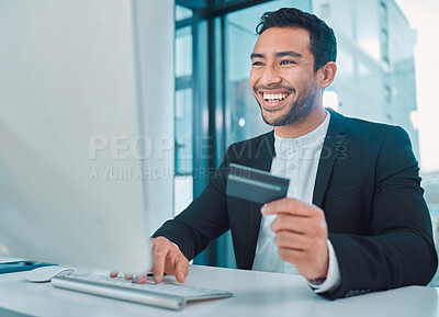 Buy stock photo Shot of a businessman using a computer and credit card at work