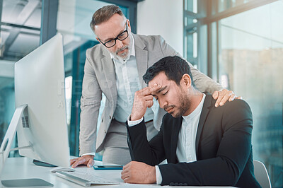Buy stock photo Shot of a man consoling his colleague in a office