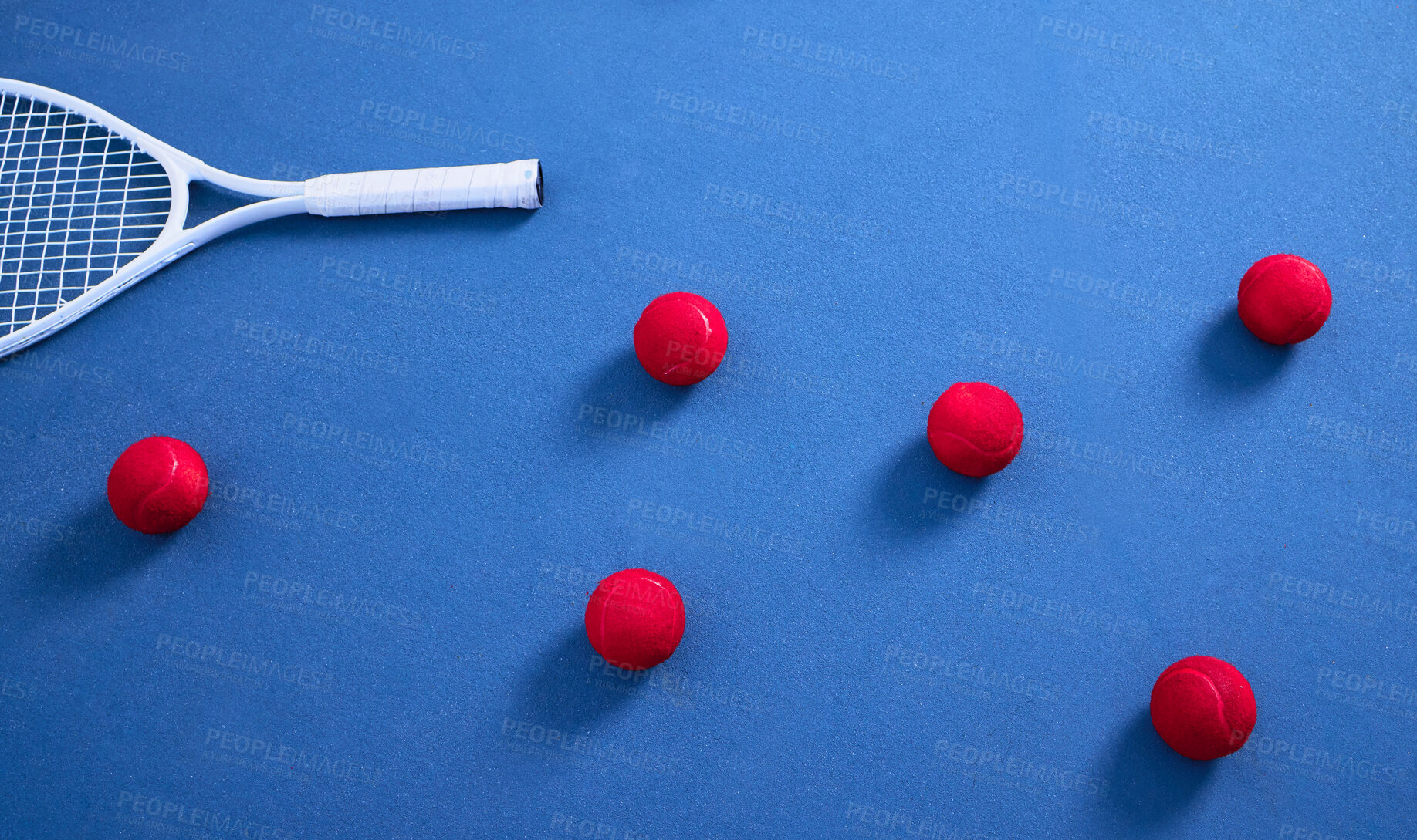 Buy stock photo Racket, floor and tennis balls for game or sport, practice and training for skill development for tournament or match. Blue court or pitch, red equipment and ground for athletic activity and fitness.