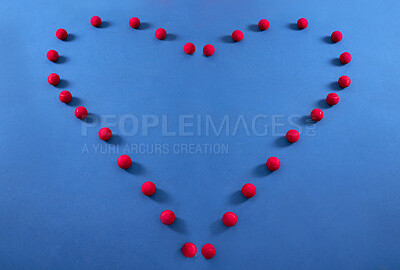 Buy stock photo Heart, pattern and tennis ball on a floor for fitness, health lifestyle and cardiovascular exercise in empty studio. Red, balls and sports equipment in frame for cardio wellness, message and workout