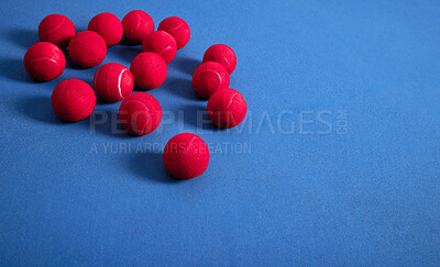 Buy stock photo Closeup, ground and tennis balls for game or sport, practice and training for skill development for tournament or match. Blue court or pitch, red equipment and floor for athletic activity and fitness