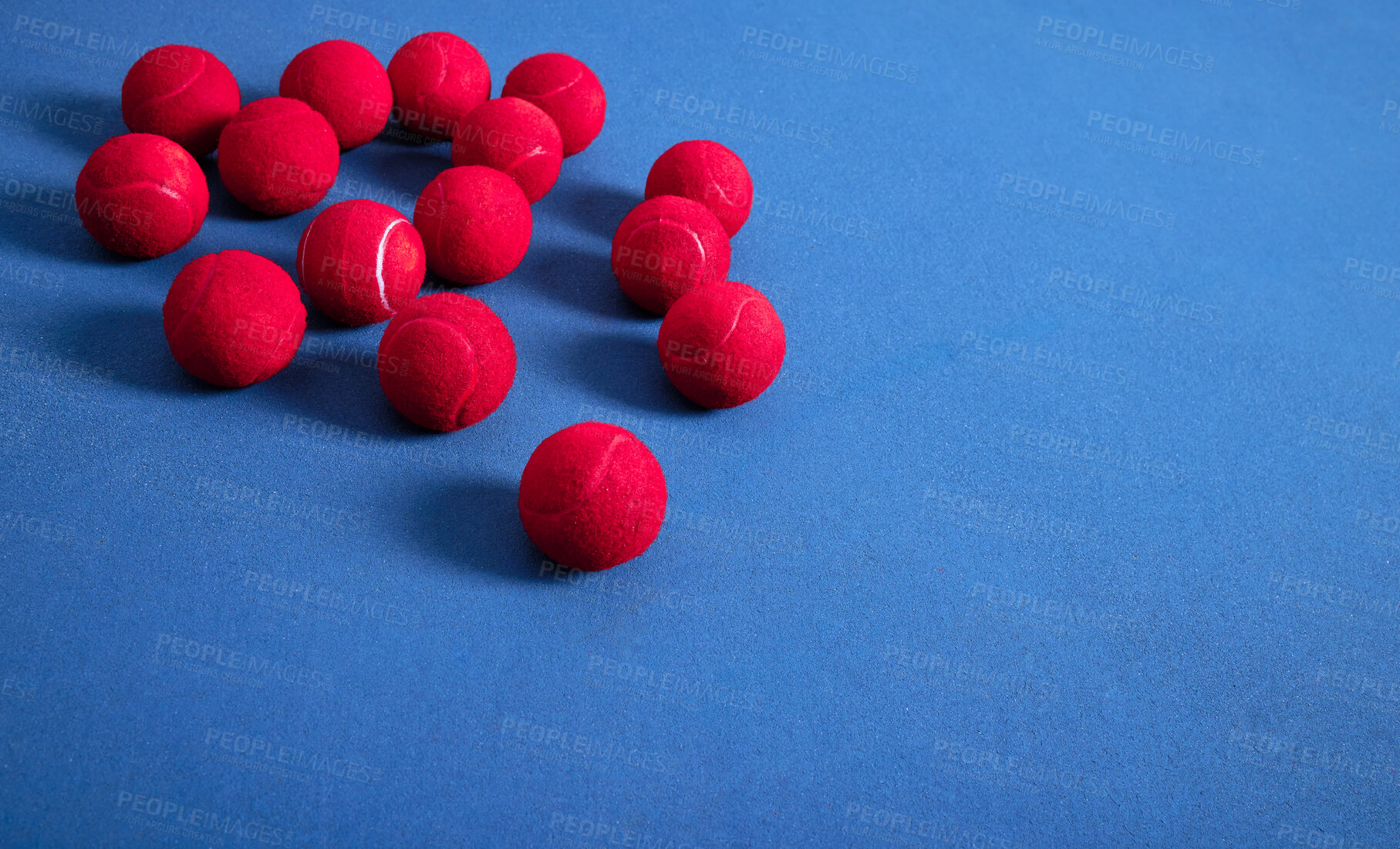 Buy stock photo Closeup, ground and tennis balls for game or sport, practice and training for skill development for tournament or match. Blue court or pitch, red equipment and floor for athletic activity and fitness