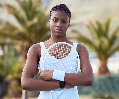 Buy stock photo Shot of a young woman holding  a racket on a tennis court