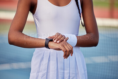 Buy stock photo Shot of a unrecognizable woman standing on a tennis outside
