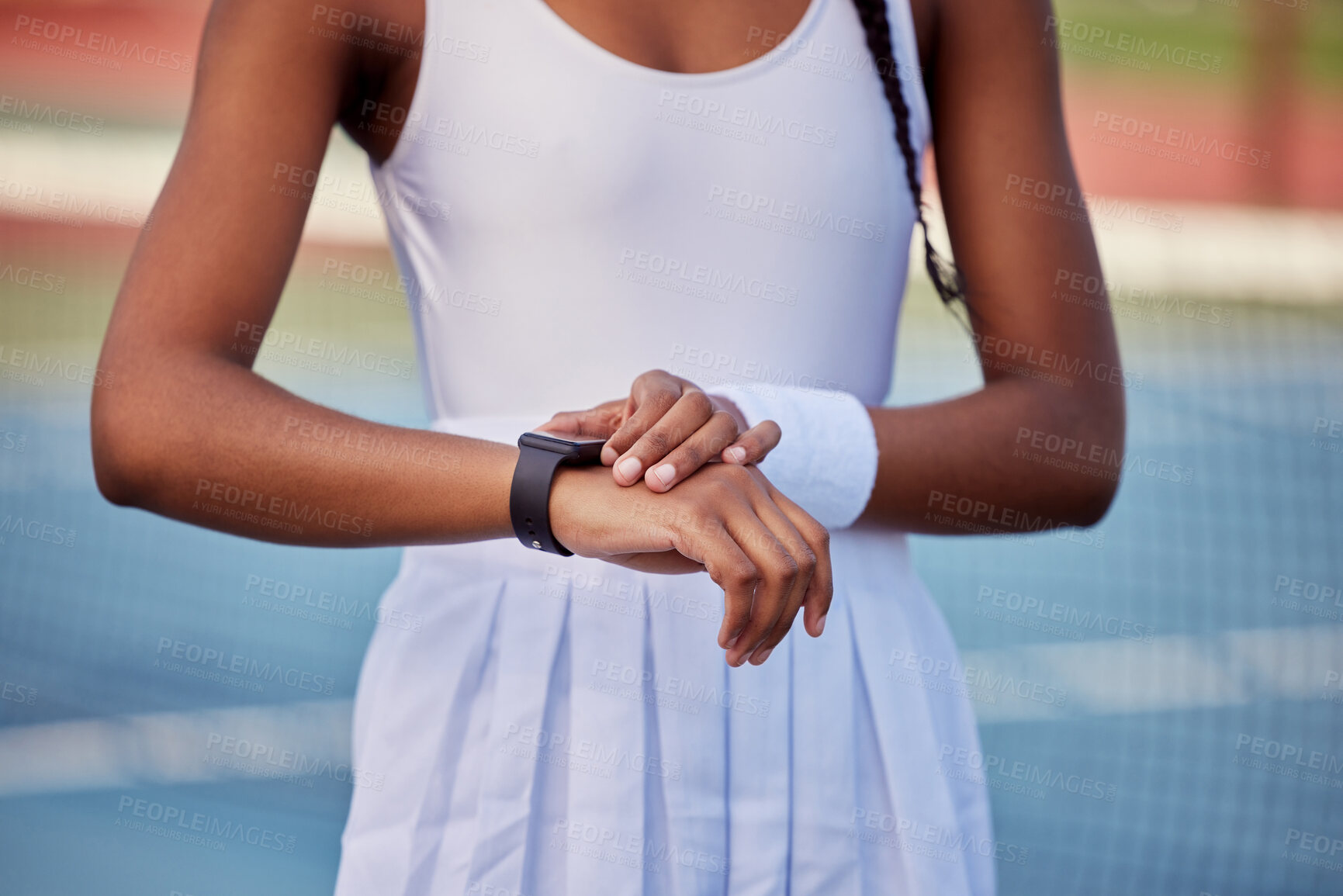 Buy stock photo Woman, tennis and smart watch for outdoor training with check heart rate, health info and body stats. Sports athlete, wearable tech and monitor performance for workout, progress and app data on court