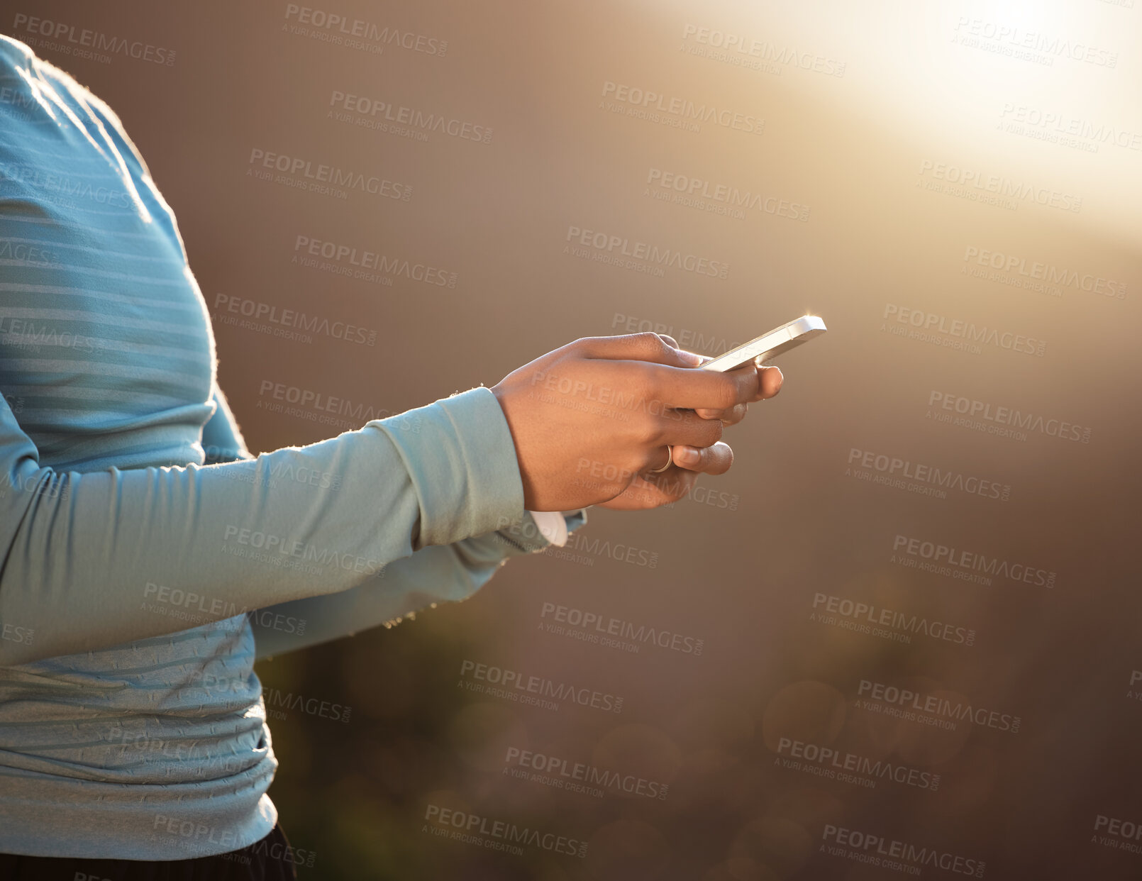 Buy stock photo Shot of a woman using her smartphone to send a text