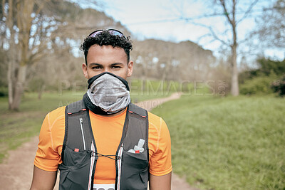 Buy stock photo Portrait, fitness and man outdoor for marathon, exercise or workout with mask in nature. Long distance runner, face and athlete at forest to prepare for race, competition or training for body health